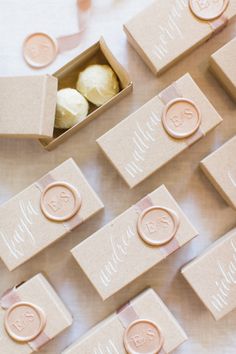 wedding favors and candy are laid out on the table