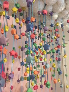 colorful stars and balls hanging from the ceiling