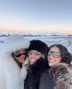 three women taking a selfie in the snow