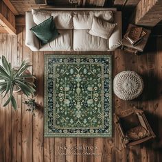 an overhead view of a living room with wood paneling and rug on the floor