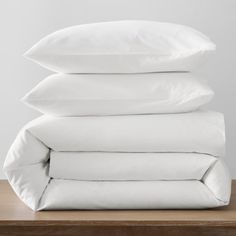 four pillows stacked on top of each other