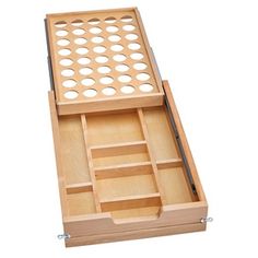 an open drawer with several compartments on the bottom and one in the middle that is empty