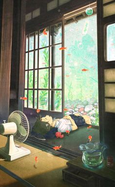 an image of a room with fish in the water and a fan on the floor