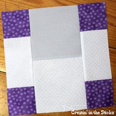 the block is made up of white and purple squares