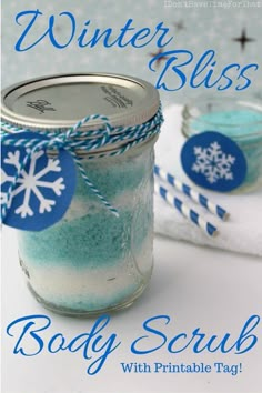 a jar filled with body scrub sitting on top of a table next to a towel