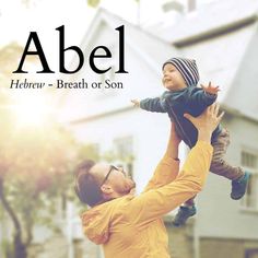 a man holding a child up in the air with an ad for abel above him