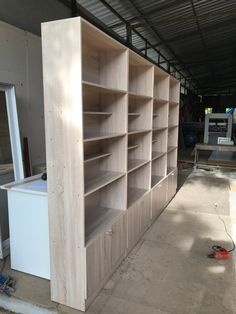 an unfinished bookcase is being built in the garage