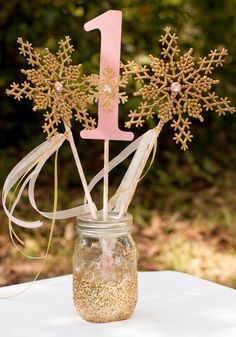 a snowflake cake topper in a mason jar