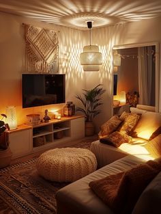 a living room filled with lots of furniture and lights on the wall next to a flat screen tv