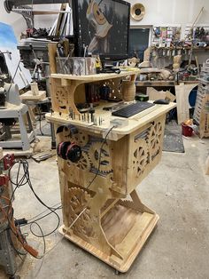 a workbench made out of wood with various tools and equipment on it in a workshop