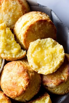 a plate full of biscuits with butter on top