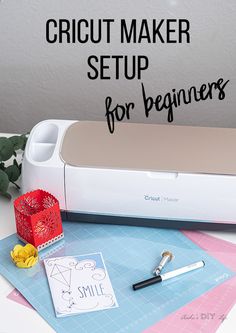 the cricut maker setup for beginners is sitting on top of some paper