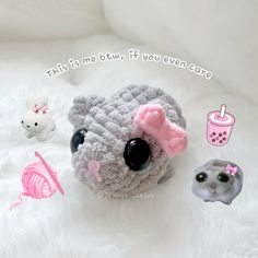 there is a small crocheted animal with pink bow on it's head