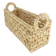 a woven basket with handles is shown on a white background for use as a decorative item