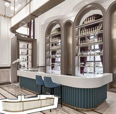 the interior of a bar with blue chairs