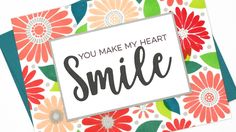 a card with the words you make my heart smile on it and colorful flowers in the background