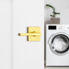 the door handle is gold in color, and it has a washer behind it