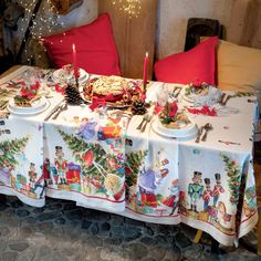 a decorated table with candles and plates on it