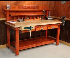 an old fashioned workbench with tools on it