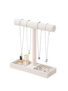 a jewelry holder with three necklaces hanging from it's sides and two boxes on the other side