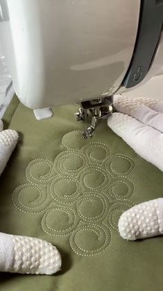 a close up of a sewing machine with towels on it