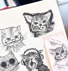 three drawings of cats are shown on a piece of paper with pen and ink in it