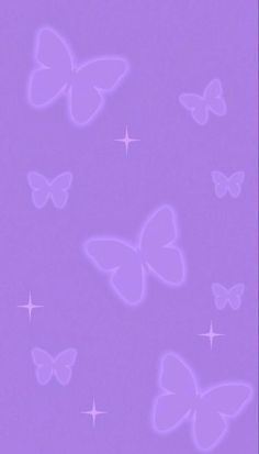 a purple background with many butterflies flying in the air