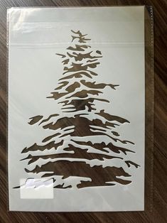 a piece of paper that has been cut out to look like a christmas tree on it