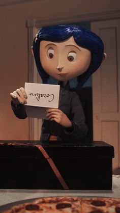 an animated doll holding up a sign next to a pizza