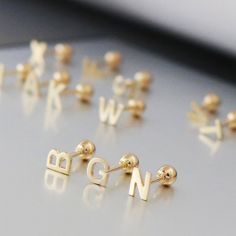 Initial Studs 14K Solid Gold Earrings Personalised Earrings Initial Letter Earrings Screw Back Earrings for Women Men Girls Gift for Her (price per single stud) ♡ Adding a personal touch or secret code for her or him, this minimal letter stud is a great gift to consider. Made of 14K solid gold, together with favourite screwback ball, it is a lively, quality, and long-lasting stud to go with any of your outfits. Perfect gift for her or self-gifting. Perfect Christmas present for her. * Materials: Gold Pierced Earrings For Birthday, Minimalist Gold Earrings For Mother's Day, Gold Dangle Earrings For Birthday, Gold Minimalist Earrings For Mother's Day, Gold 14k Earrings For Mother's Day, Mother's Day Gold Pierced Earrings, Classic Style Initials Earrings Perfect For Gifting, Personalized Yellow Gold Dangle Earrings, Mother's Day 14k Gold Earrings