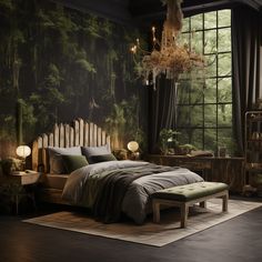 a bedroom with a large bed and green trees on the wall, along with a chandelier