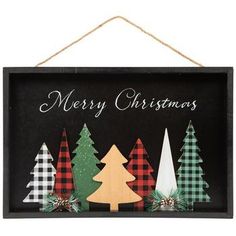 a wooden sign with christmas trees on it