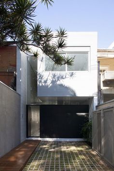 the house is made up of white walls and windows