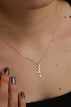 This cute 925 sterling silver necklace is a must for every woman. Can be worn alone, or layered with other necklaces for a trendier look. This silver animal necklace comes in a beautiful box, gift-ready!  ❤️ It would be an amazing gift for Anniversary, Birthdays, Christmas, Mother's Day, Women's Day. FEATURES - Material: High Quality Solid 925 Sterling Silver - Pendant height: 2.2 cm - Pendant width: 0.7 cm - Color Options: Silver, Yellow Gold, Rose Gold - Chain length 16 inches, 18 inches or 20 inches ❤️Production Techniques: Handmade and Laser Cutting (for High Quality) PACKING ❤️ All products are ready to be sent to you in stylish gift boxes. Also, there is no need for gift wrapping. SHIPPING AND RETURN - Production is made according to the order and delivered to the cargo next day. - S Nickel-free Silver Music-themed Necklaces, Silver Music-themed Necklace For Gift, Music-themed Sterling Silver Necklace, Nickel-free Sterling Silver Music-themed Necklace, Silver Sterling Music-themed Necklace, Music-themed Silver Pendant Necklace, Sterling Silver Music-themed Pendant Necklace, Music-themed Sterling Silver Pendant Necklace, Music Pendant