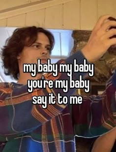 a woman taking a selfie in the mirror with her cell phone and texting, my baby my baby you're my baby say it to me