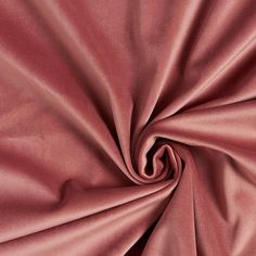 a close up shot of the fabric in maroon color, it is very soft and smooth