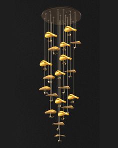 a chandelier made out of gold colored objects hanging from it's ceiling