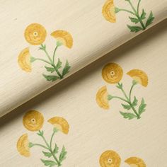 an image of yellow flowers on white fabric