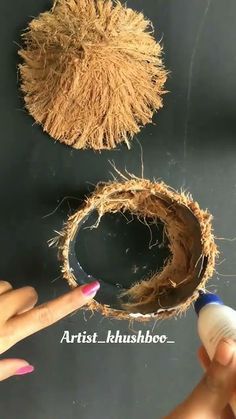 someone is painting the inside of a coconut shell with acrylic paint and glue