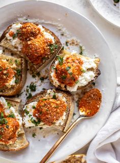 an overhead view of baked potato skins with cheese and parsley on the side, along with other appetizers