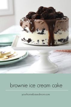 an ice cream cake with chocolate toppings on top and the words brownie ice cream cake above it