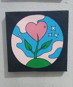 a painting of a heart and a flower on a white wall with stars in the background