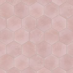 a pink tile pattern with hexagonal shapes