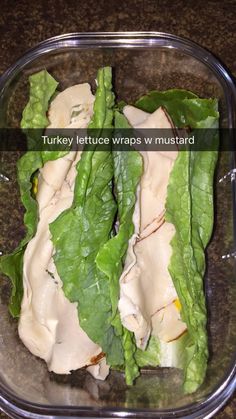 lettuce wraps with mustard in a plastic container