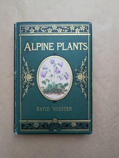 the front cover of a book with flowers on it