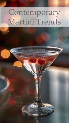 a martini glass filled with liquid on top of a table