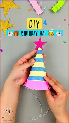 someone is decorating a birthday hat with streamers and confetti on it