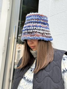 This women's knitted hat is crafted from soft and textured boucle yarn, offering both warmth and style. The unique boucle texture adds a cozy, fashionable touch, making this hat a standout accessory for colder weather. Each hat is handmade with attention to detail, ensuring comfort and durability. Perfect for adding a bit of texture and warmth to your winter wardrobe, this hat is a must-have for the season.  MATERIALS and FEATURES Acrylic 75% Wool 23% Polyester2%.  SIZES Boucle hats are availabl Winter Bucket Hat, Winter Crochet, Boucle Yarn, Crochet Bucket, Crochet Bucket Hat, Hat Handmade, Hat For Women, Knitted Hat, Crochet Hat