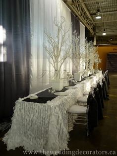 the tables are set up with black and white decorations