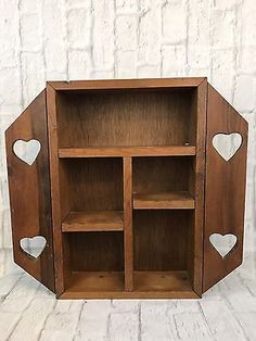 a wooden shelf with hearts on it